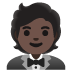 🤵🏿 person in tuxedo: dark skin tone display on Google